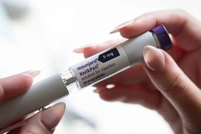 Mounjaro (tirzepatide) pre-filled injection pen held in one hand