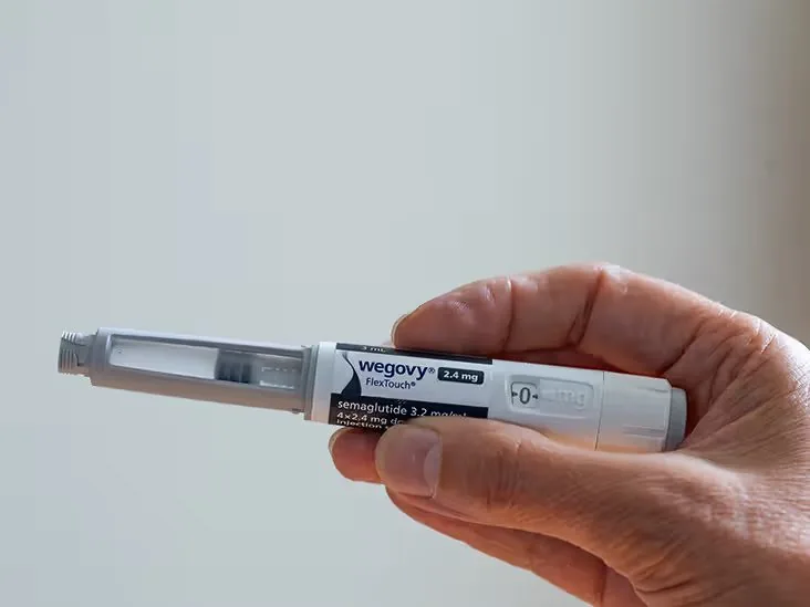 Wegovy (semaglutide) pre-filled injection pen held in one hand